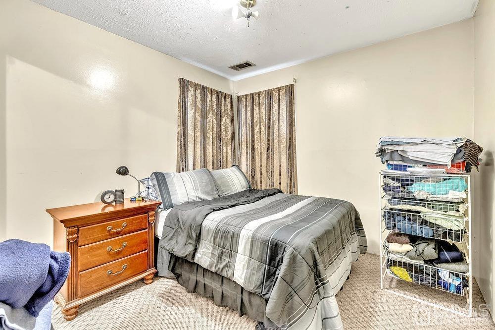 122 Vineyard Road Edison, NJ 08817 - Photo 17 of 24 a bedroom with a bed and a window