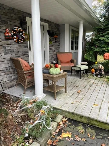 a backyard of a house with outdoor seating