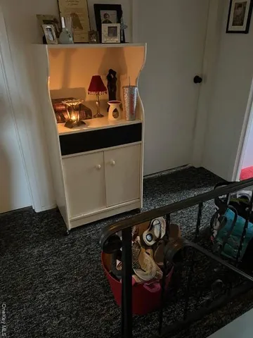 a close view of shoes stand and cabinets