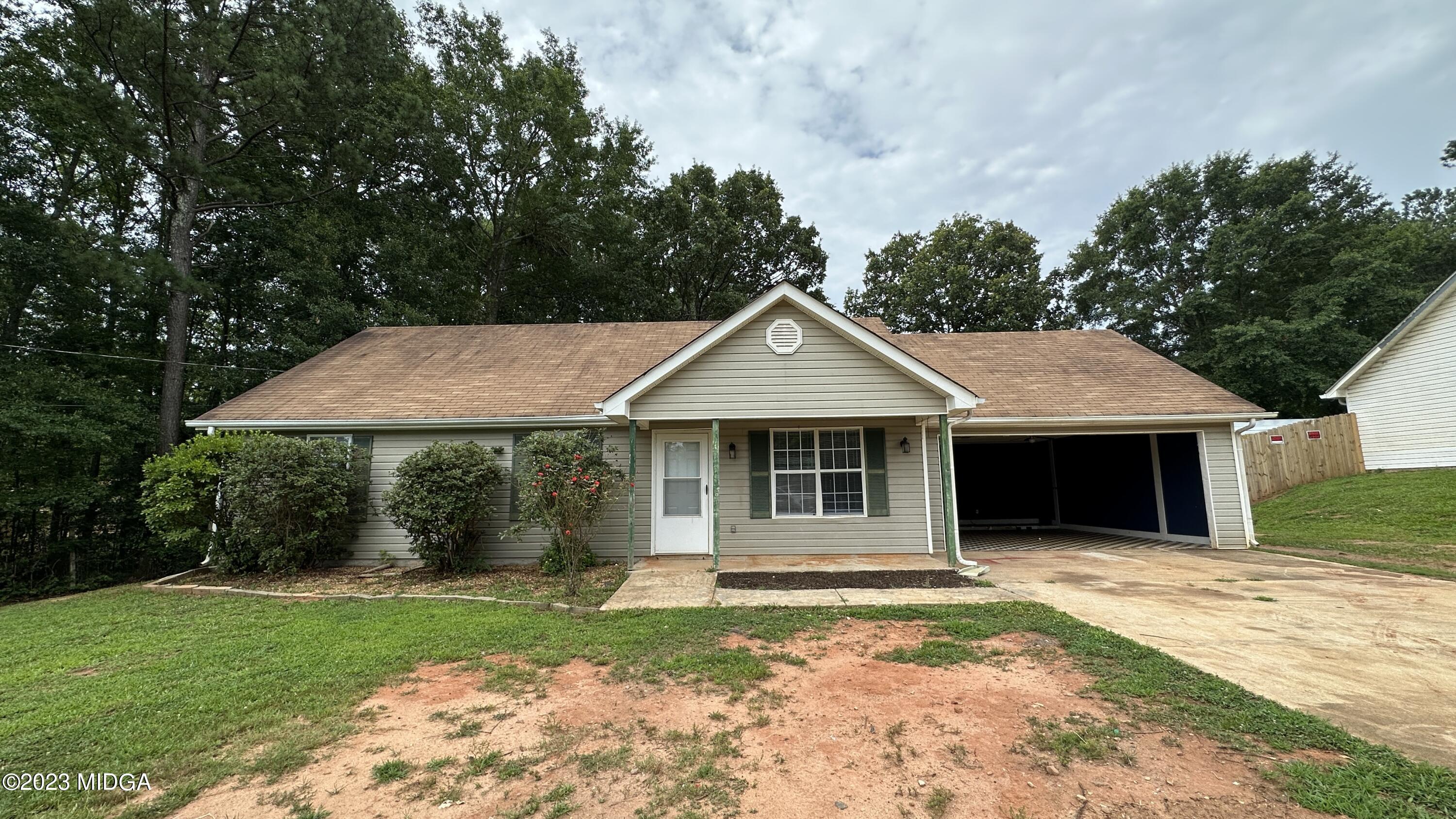 134 Haley Road Jackson, GA 30233 - Photo 1 of 11 a front view of a house with a yard