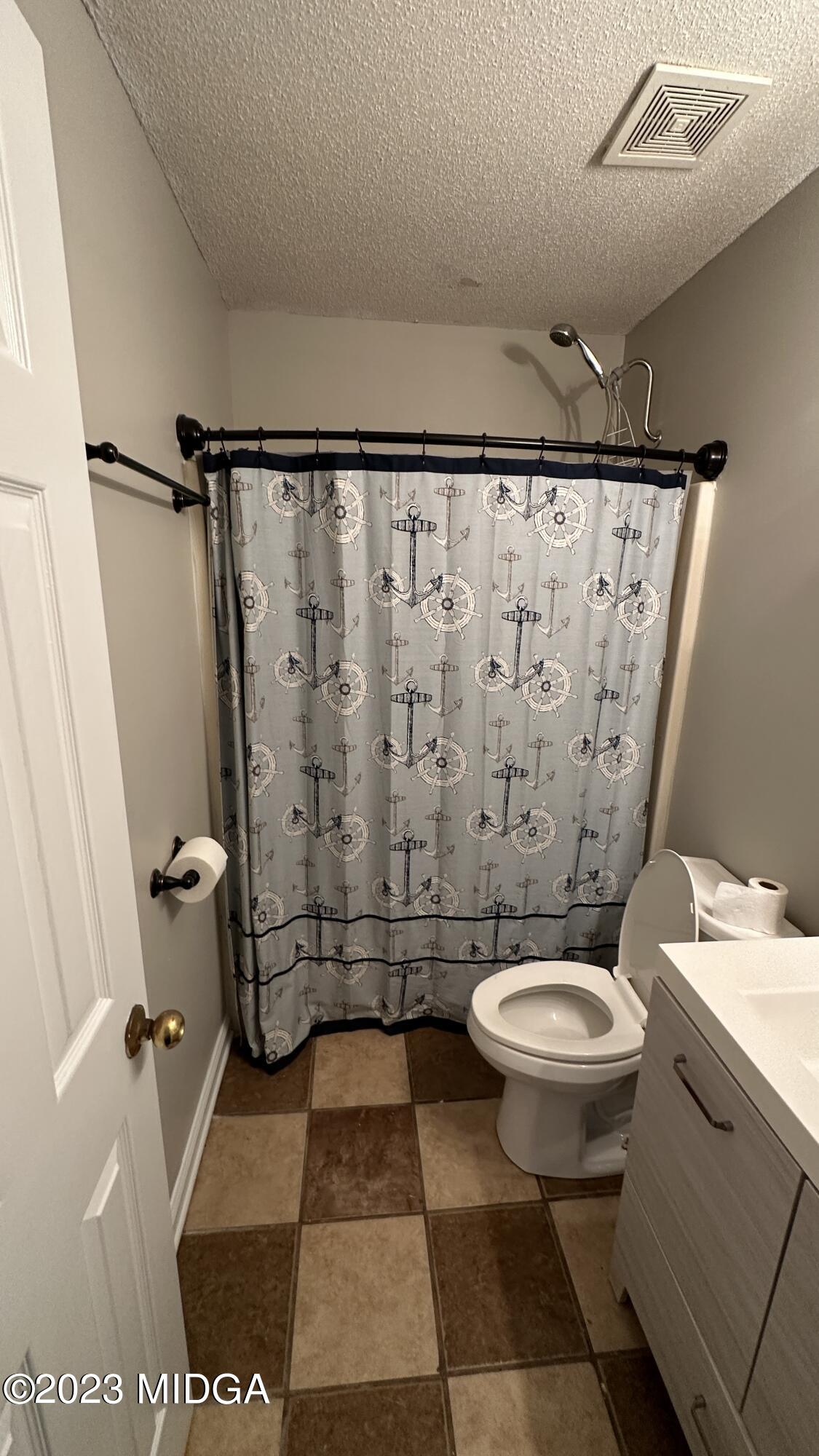 134 Haley Road Jackson, GA 30233 - Photo 5 of 11 a bathroom with a sink toilet and shower