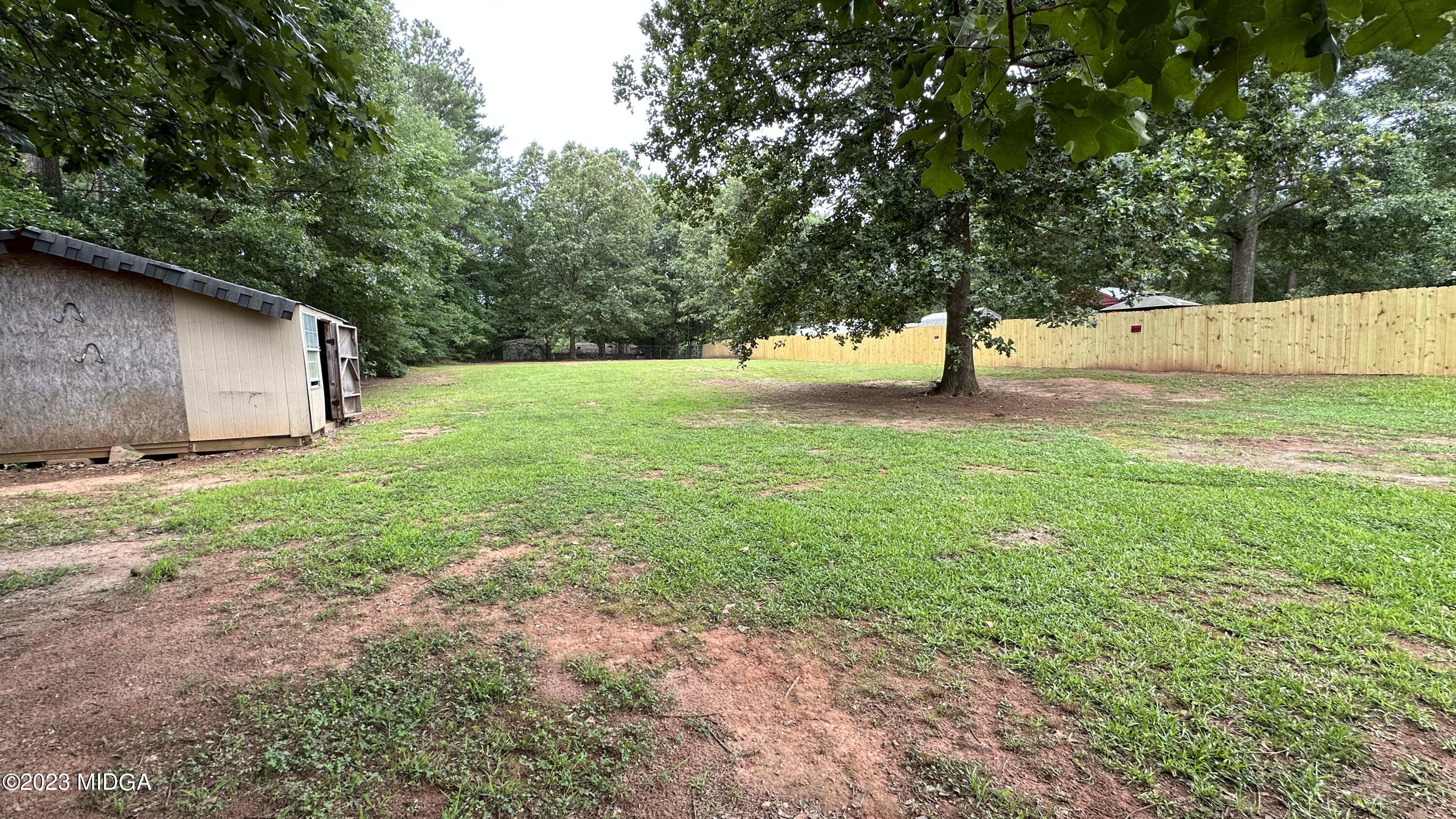 134 Haley Road Jackson, GA 30233 - Photo 7 of 11 a view of backyard with large trees