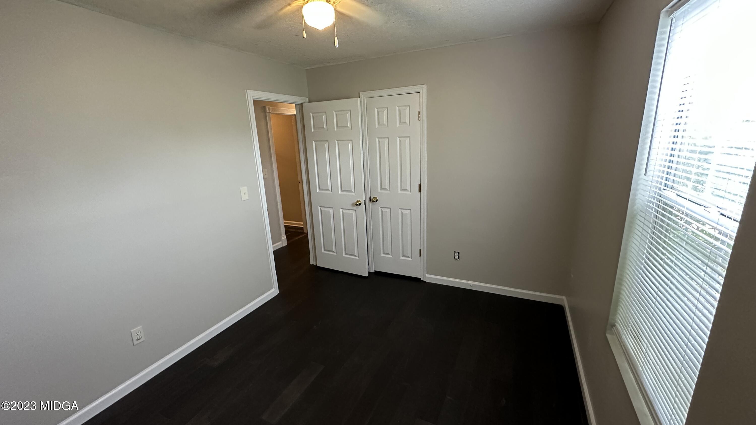134 Haley Road Jackson, GA 30233 - Photo 9 of 11 wooden floor in an empty room with a window