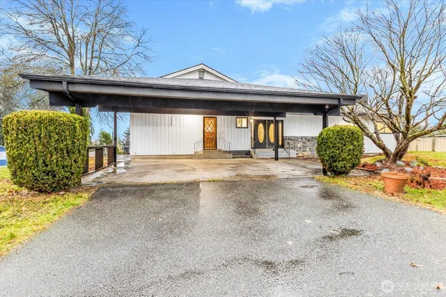 a front view of a house with garden