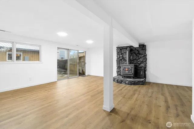 a view of an empty room with a fireplace