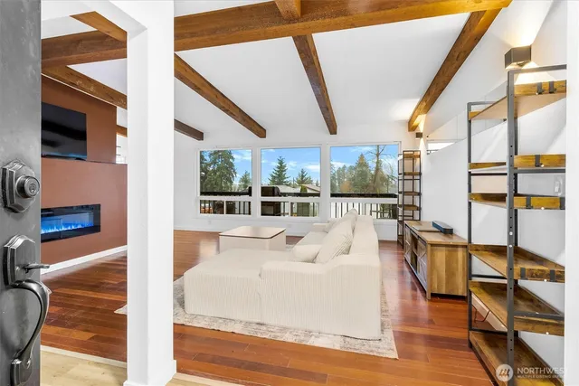 a large white bed with glass of the door