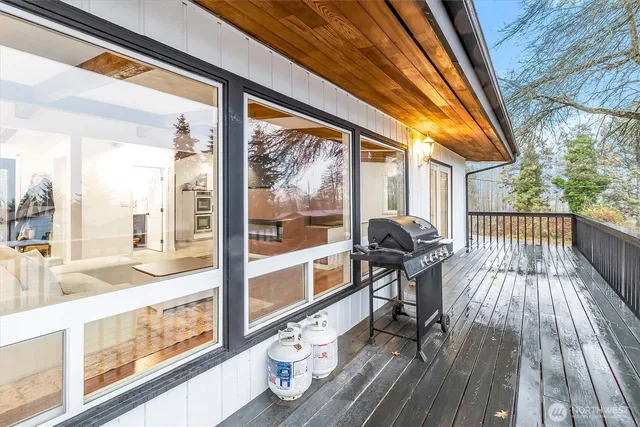 a view of a two chairs in the balcony
