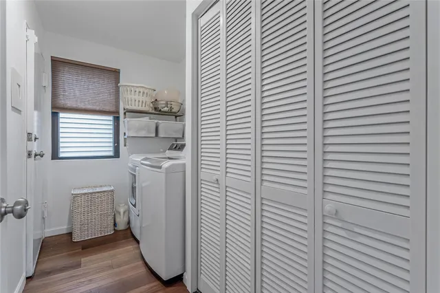 a bathroom with a sink mirror and toilet