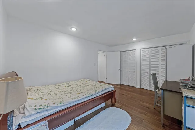 a view of a livingroom with furniture and a flat screen tv