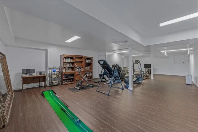 a view of balcony with wooden floor and fence