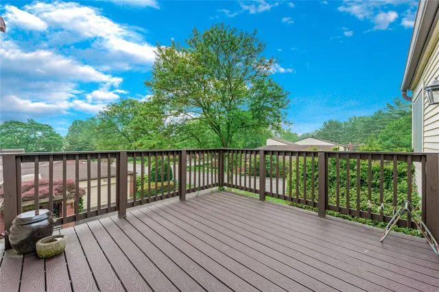 a view of a garden with a building in the background