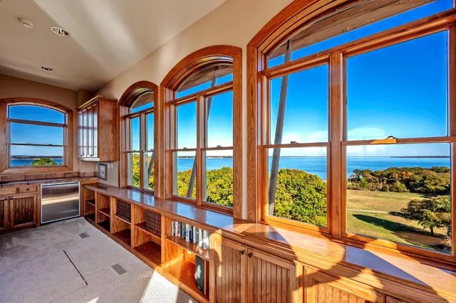 a view of an empty room with a large window