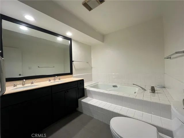 a bathroom with a sink a toilet and a bathtub