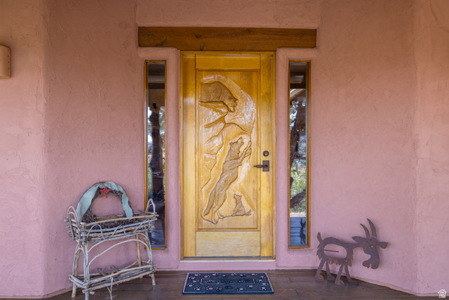 3617 Red Rock Drive Moab, UT 84532 - Photo 7 of 79 Doorway to property with stucco siding