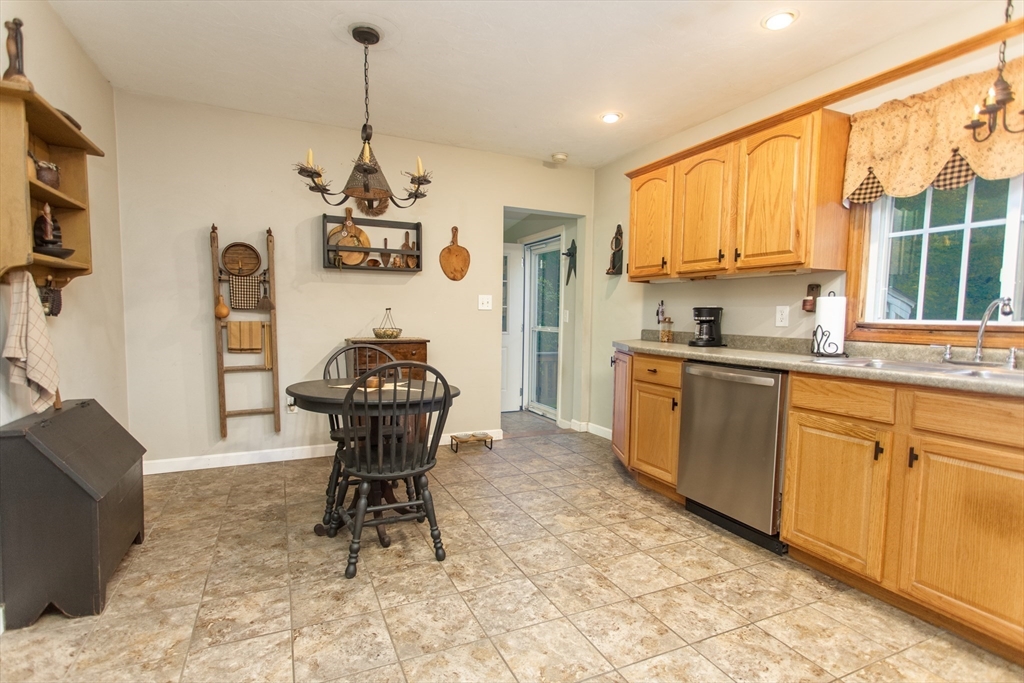 245 R Laurel Street East Bridgewater, MA 02333 - Photo 13 of 37 a kitchen with stainless steel appliances a stove a sink dishwasher and cabinets