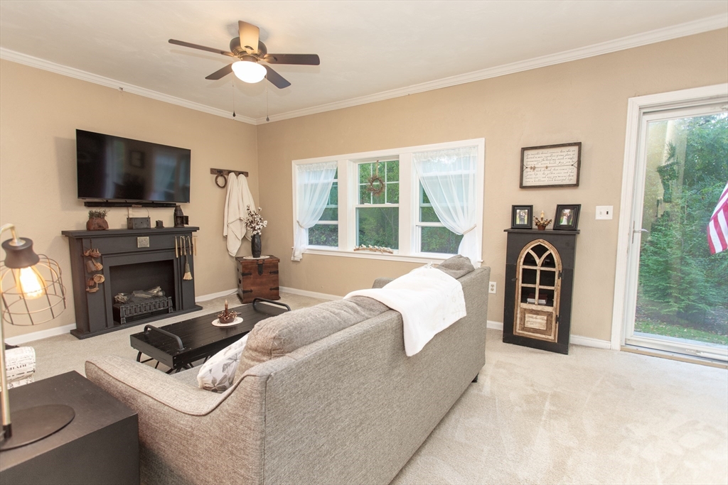 245 R Laurel Street East Bridgewater, MA 02333 - Photo 14 of 37 a living room with fireplace furniture and a flat screen tv