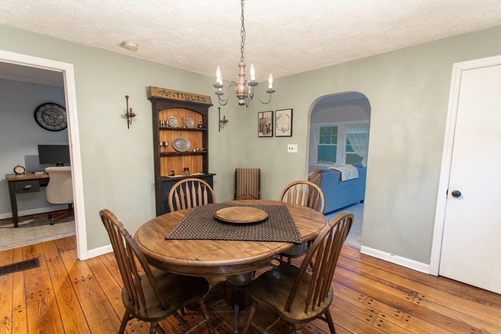 245 R Laurel Street East Bridgewater, MA 02333 - Photo 18 of 37 a view of a dining room with furniture wooden floor and chandelier