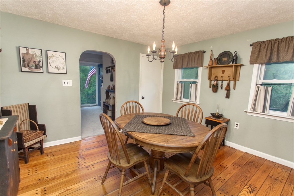 245 R Laurel Street East Bridgewater, MA 02333 - Photo 19 of 37 a view of a dining room with furniture wooden floor and a chandelier