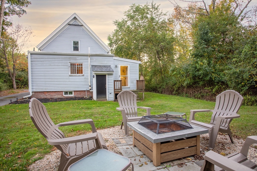 245 R Laurel Street East Bridgewater, MA 02333 - Photo 6 of 37 a view of a chair and table in backyard of the house