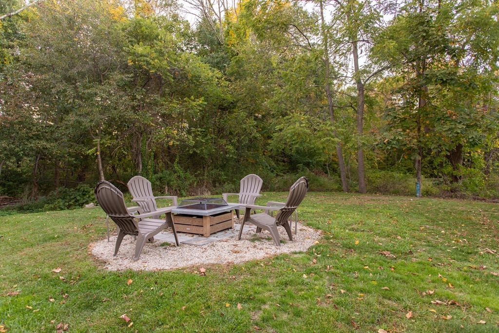 245 R Laurel Street East Bridgewater, MA 02333 - Photo 7 of 37 a backyard of a house with table and chairs