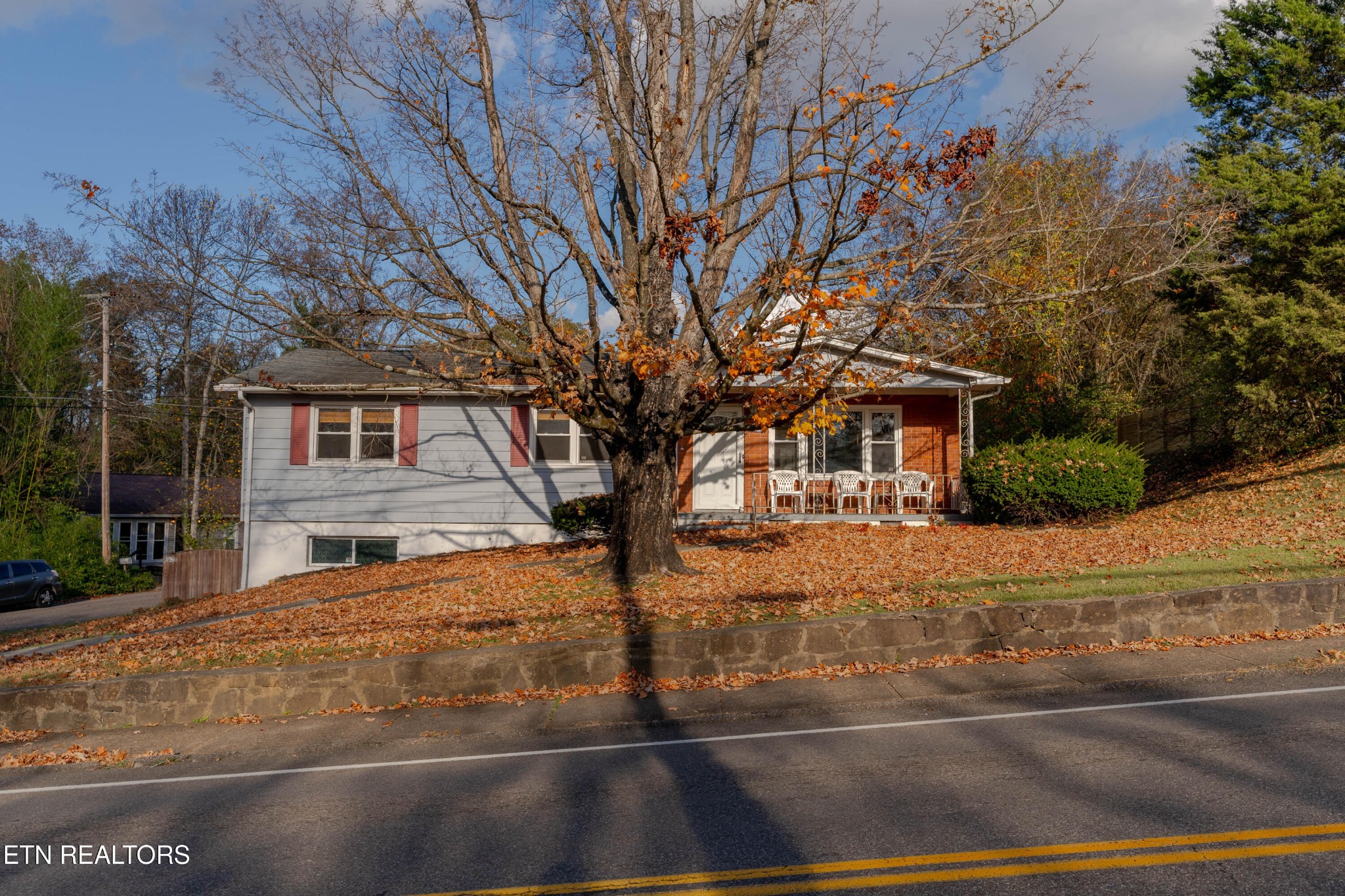 3424 Whittle Springs Road Knoxville, TN 37917 - Photo 1 of 29 a front view of a house with a yard
