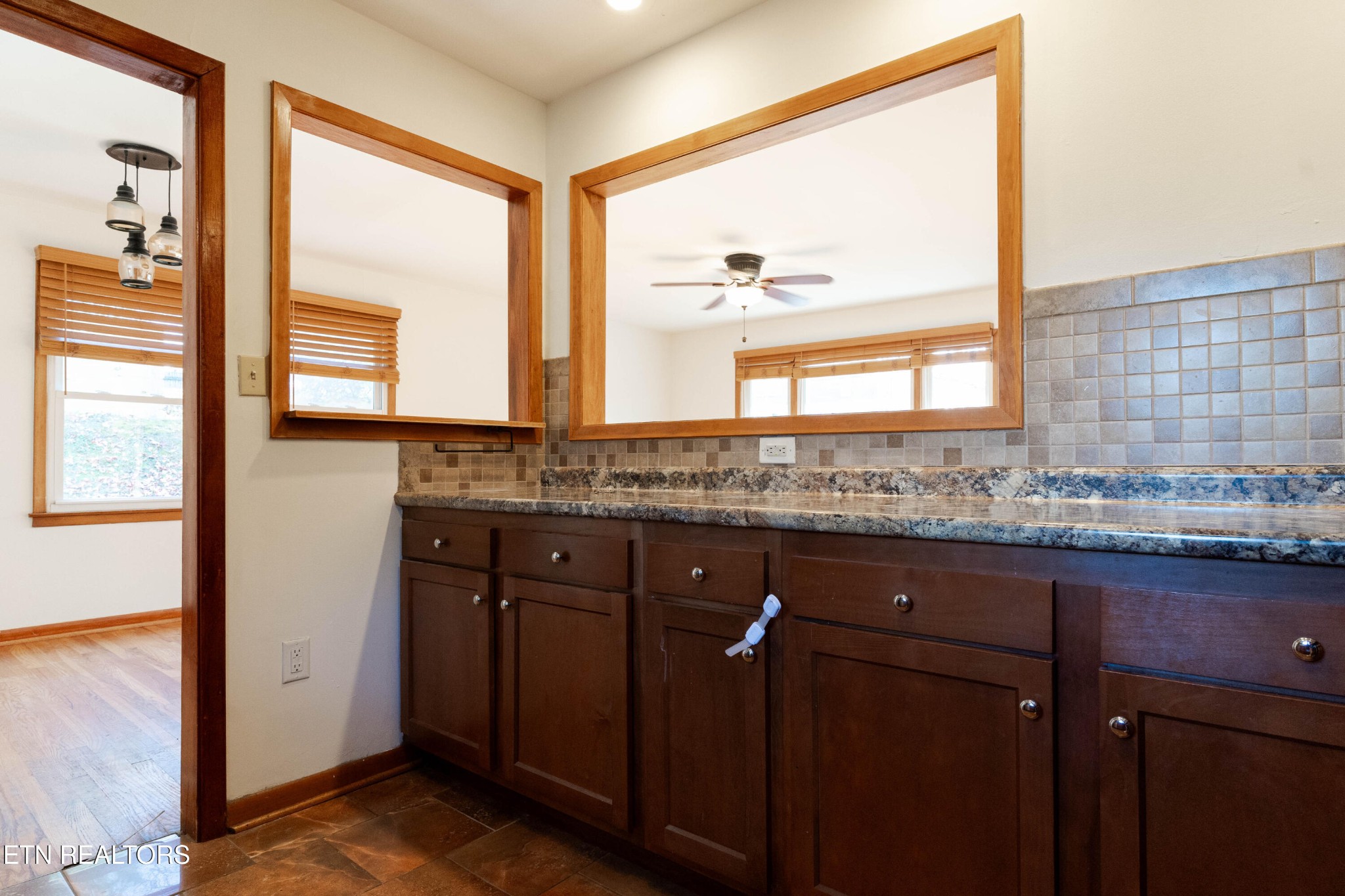 3424 Whittle Springs Road Knoxville, TN 37917 - Photo 15 of 29 a view of a granite countertop sink and a window