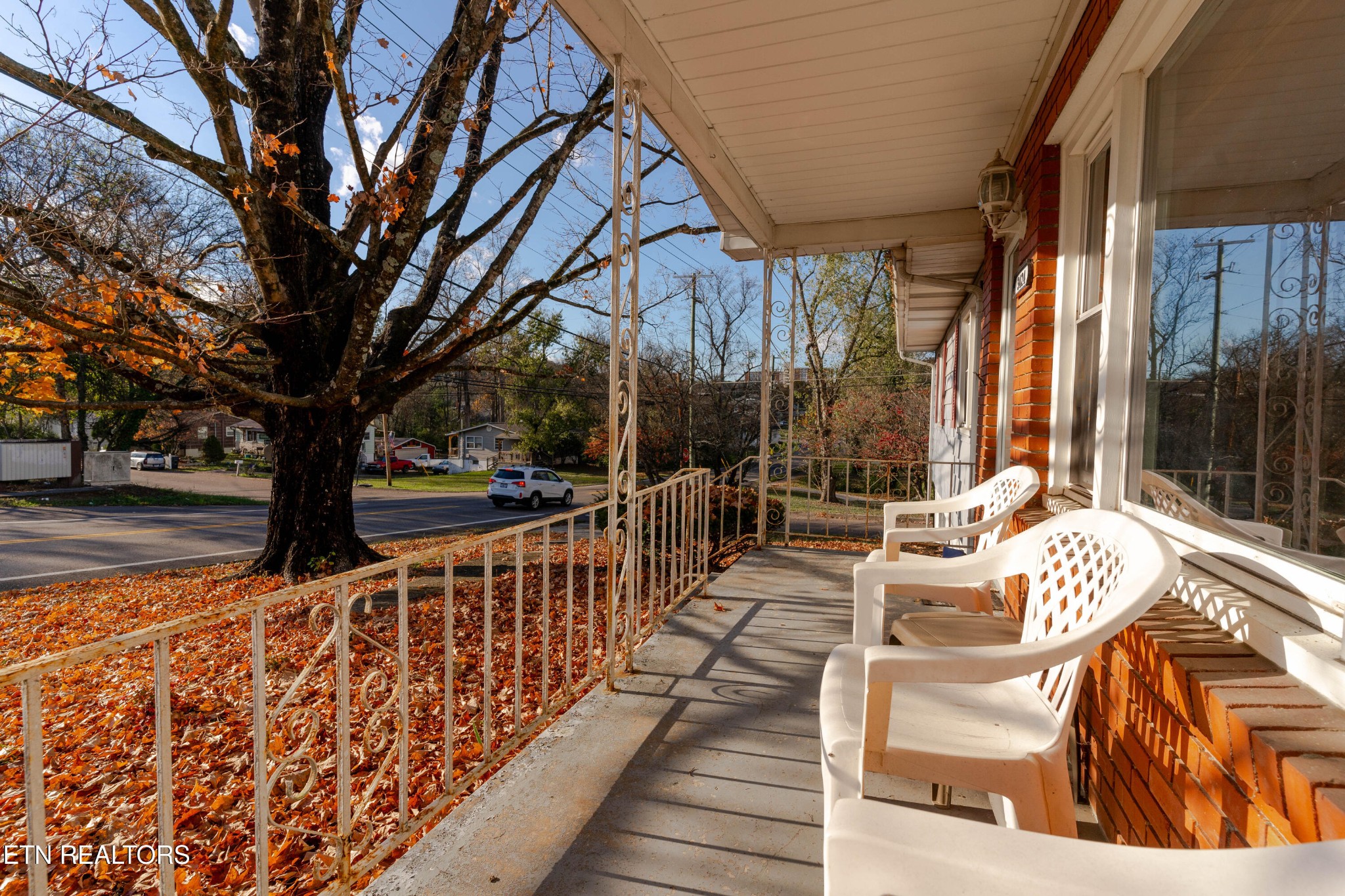3424 Whittle Springs Road Knoxville, TN 37917 - Photo 18 of 29 a view of balcony with wooden floor and outdoor seating