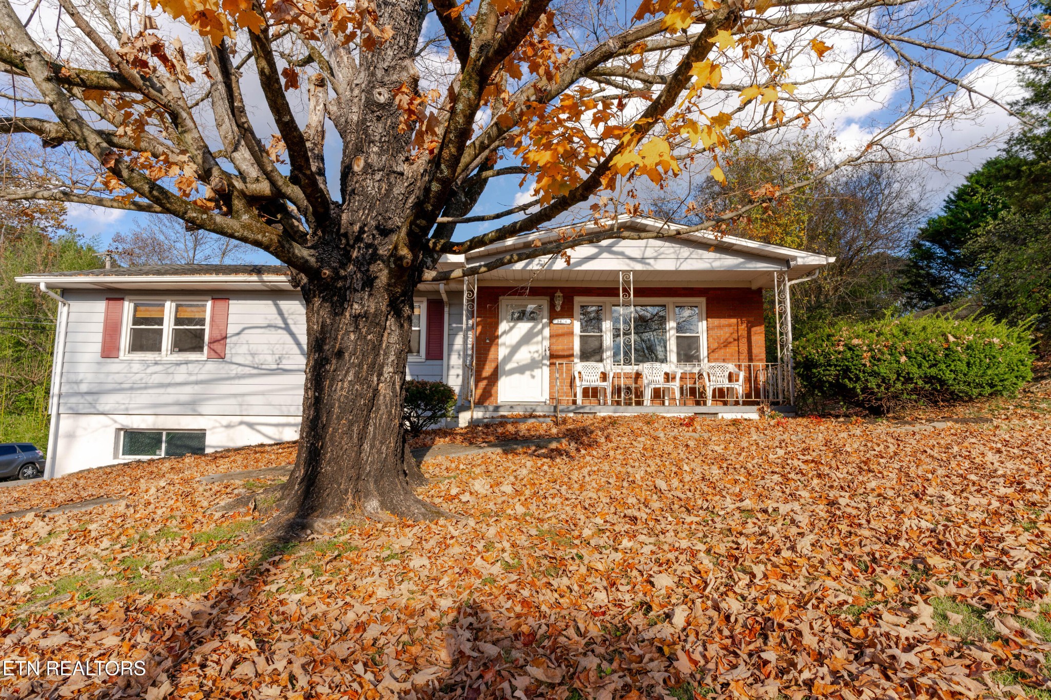 3424 Whittle Springs Road Knoxville, TN 37917 - Photo 20 of 29 a front view of a house with a garden