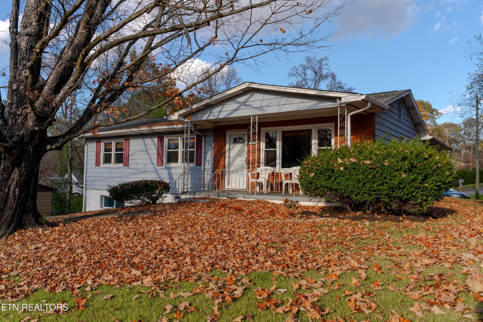 3424 Whittle Springs Road Knoxville, TN 37917 - Photo 2 of 29 a front view of a house with a yard