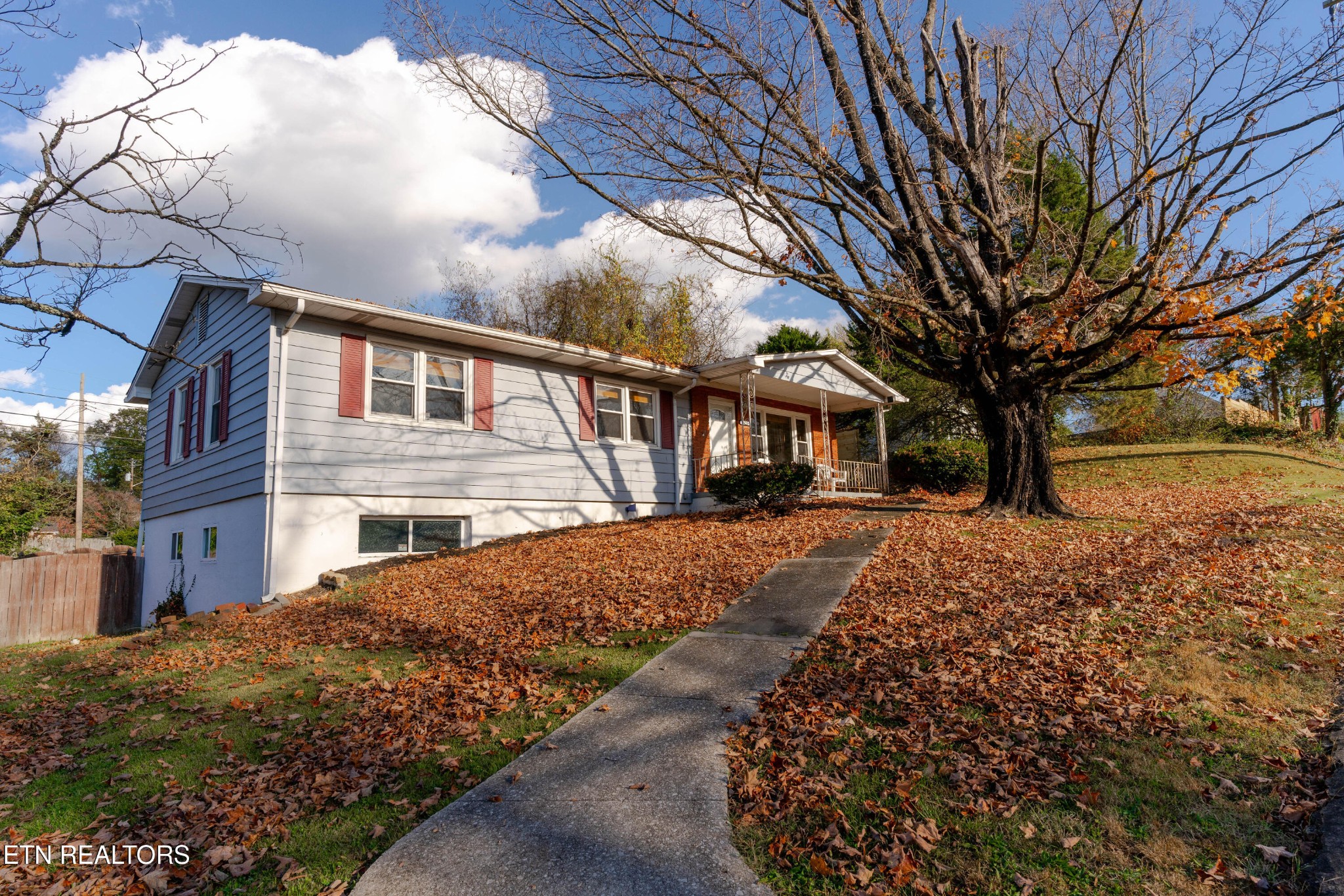 3424 Whittle Springs Road Knoxville, TN 37917 - Photo 21 of 29 a front view of a house with a yard