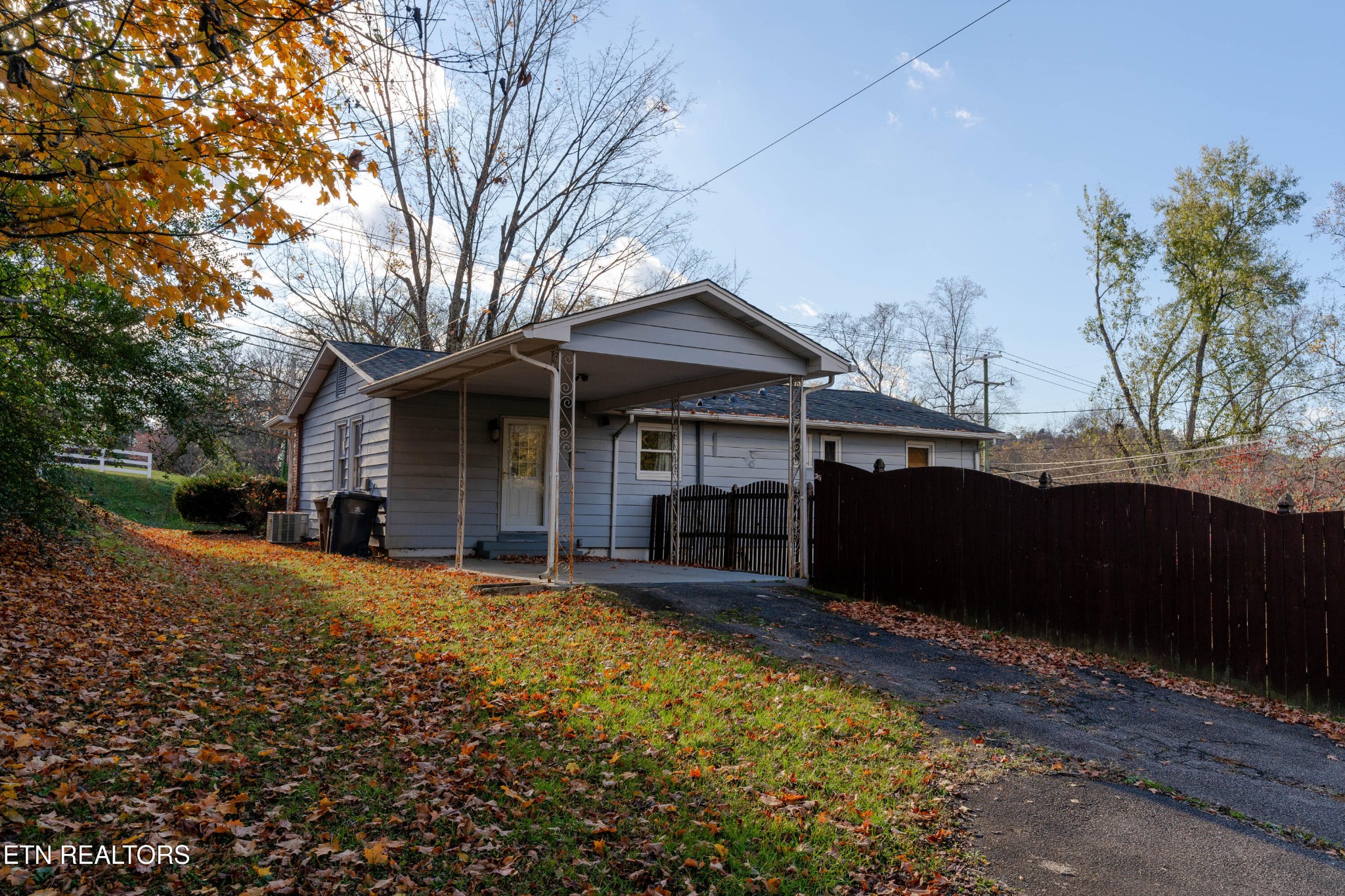 3424 Whittle Springs Road Knoxville, TN 37917 - Photo 23 of 29 a front view of a house with a yard