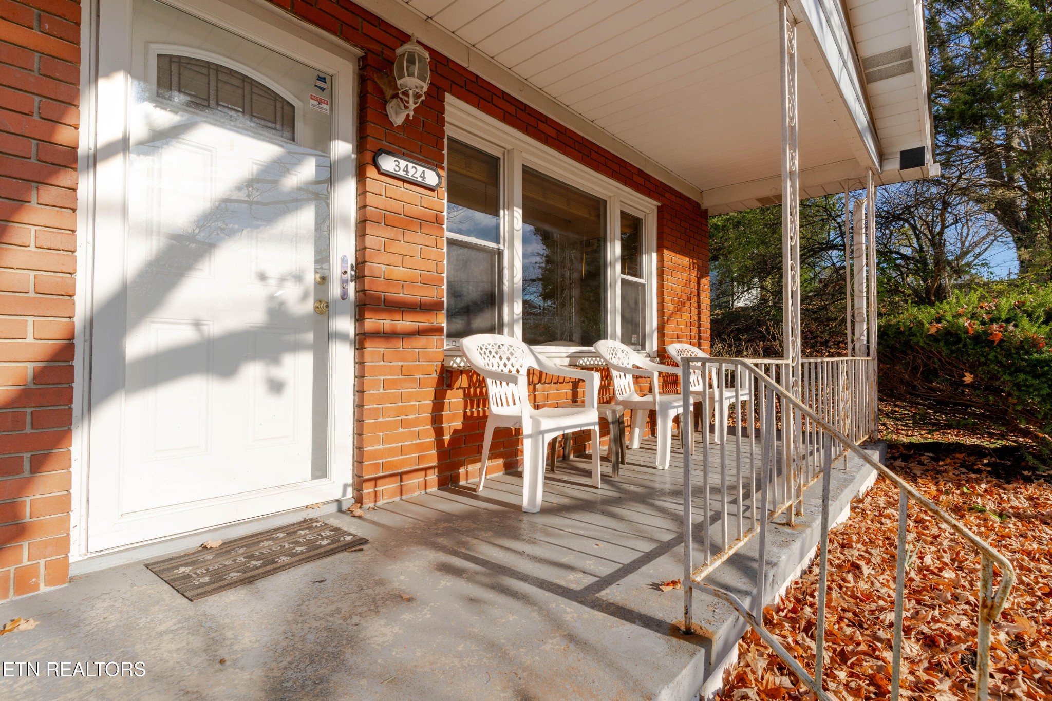 3424 Whittle Springs Road Knoxville, TN 37917 - Photo 3 of 29 a view of a patio with table and chairs and potted plants