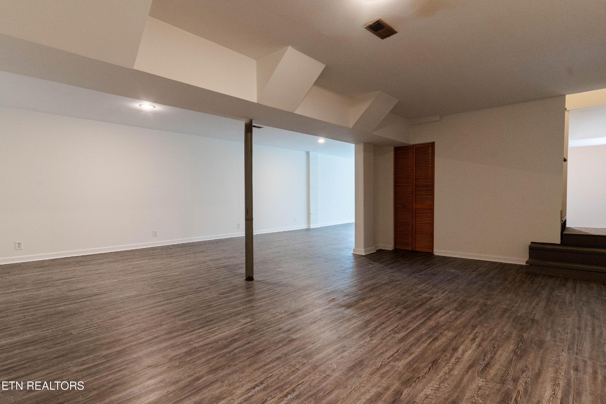 3424 Whittle Springs Road Knoxville, TN 37917 - Photo 7 of 29 a view of a livingroom with wooden floor