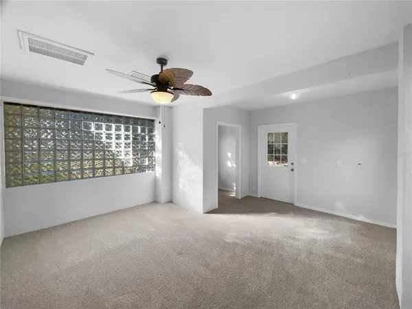 a view of an empty room with a window