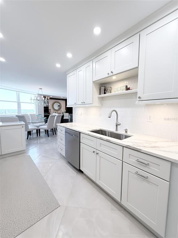 1050 Longboat Club Road, Unit 803 Longboat Key, FL 34228 - Photo 17 of 39 a kitchen with sink cabinets and window