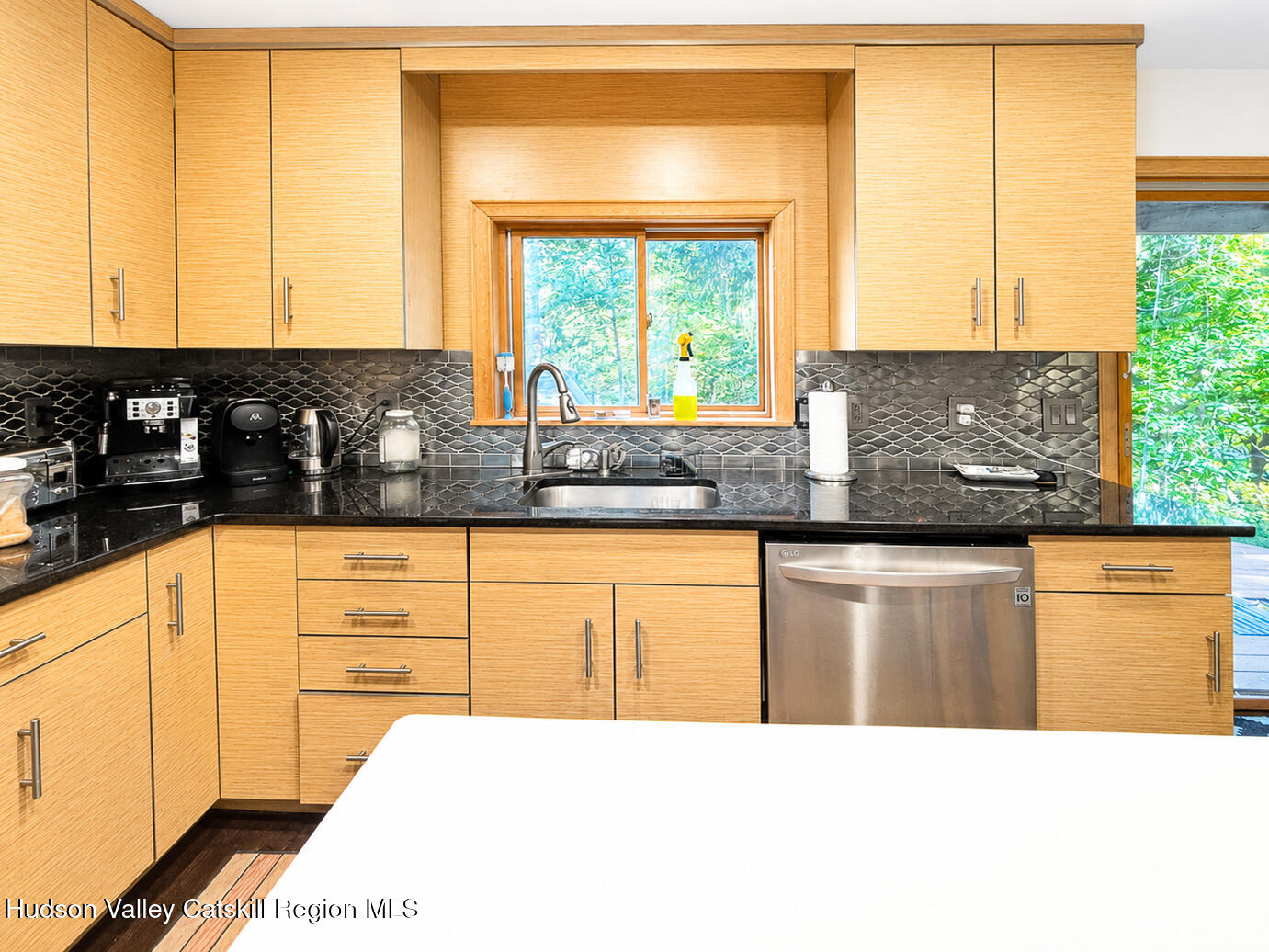 14 Park Road Chichester, NY 12416 - Photo 5 of 20 a kitchen with stainless steel appliances kitchen island wooden cabinets a sink and a large window