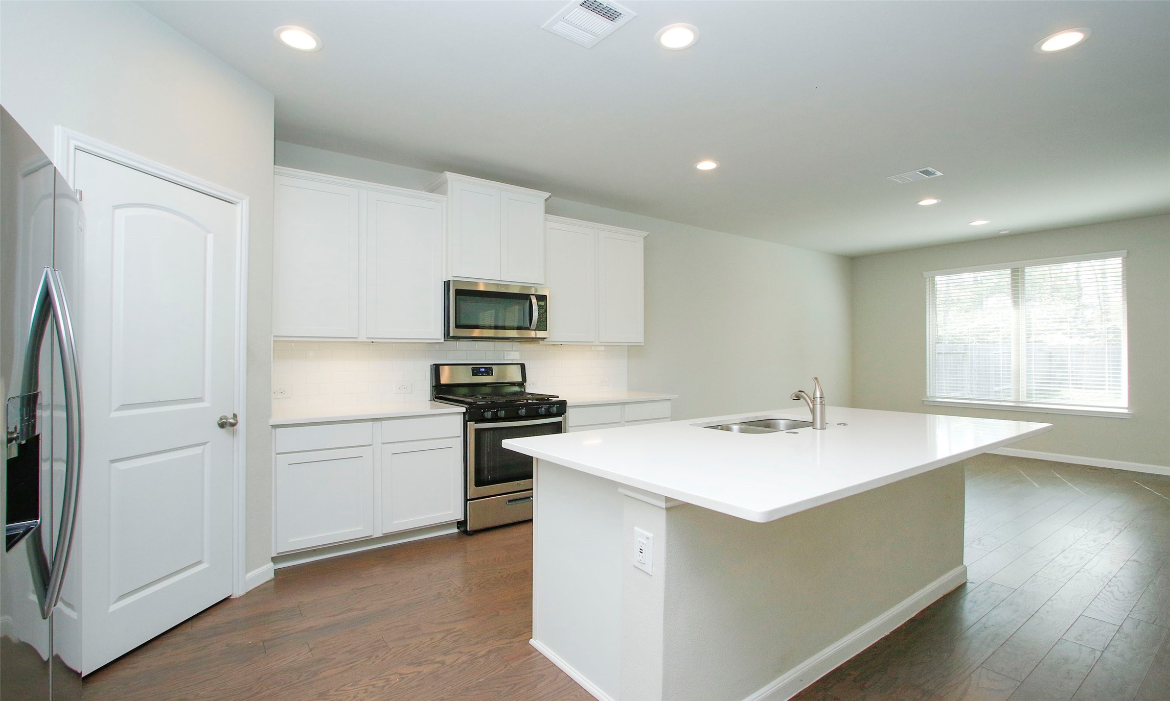14120 Sand Ridge Court Conroe, TX 77384 - Photo 15 of 43 a kitchen with a sink appliances and cabinets