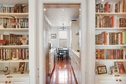 a view of a livingroom with furniture and staircase