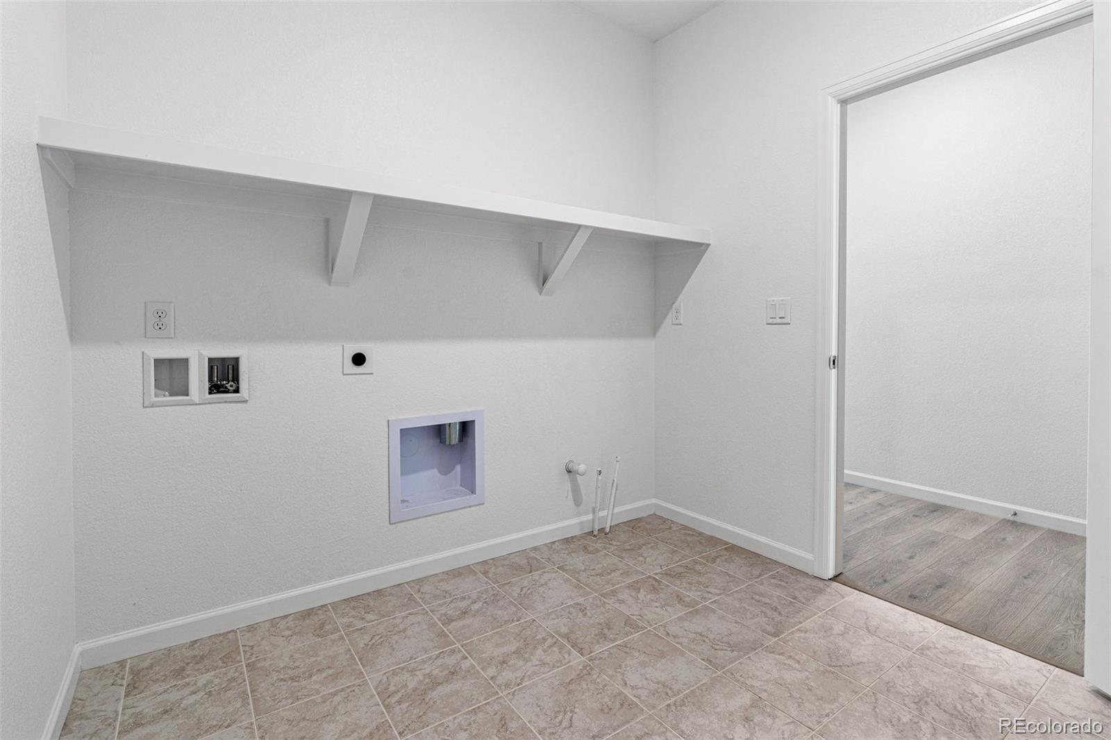 23936 River Front Drive Aurora, CO 80019 - Photo 21 of 46 an empty room with a empty space