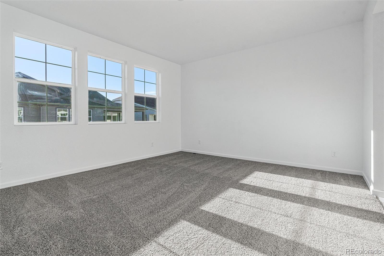 23936 River Front Drive Aurora, CO 80019 - Photo 22 of 46 a view of an empty room with a window