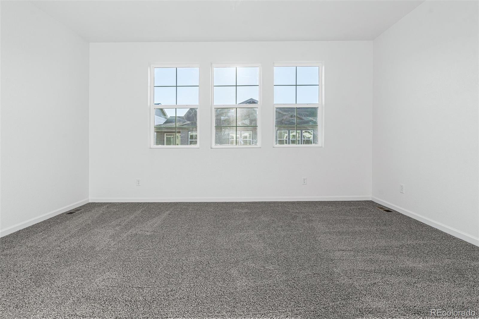 23936 River Front Drive Aurora, CO 80019 - Photo 23 of 46 an empty room with a window