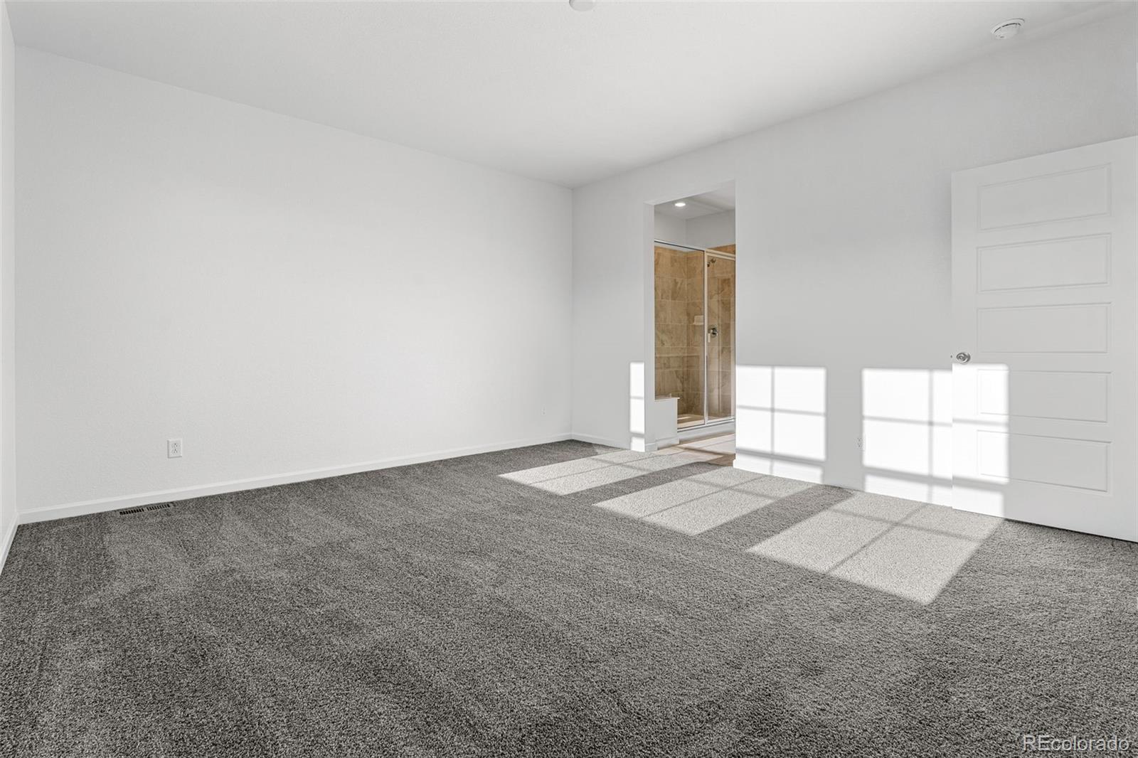 23936 River Front Drive Aurora, CO 80019 - Photo 24 of 46 an empty room with windows