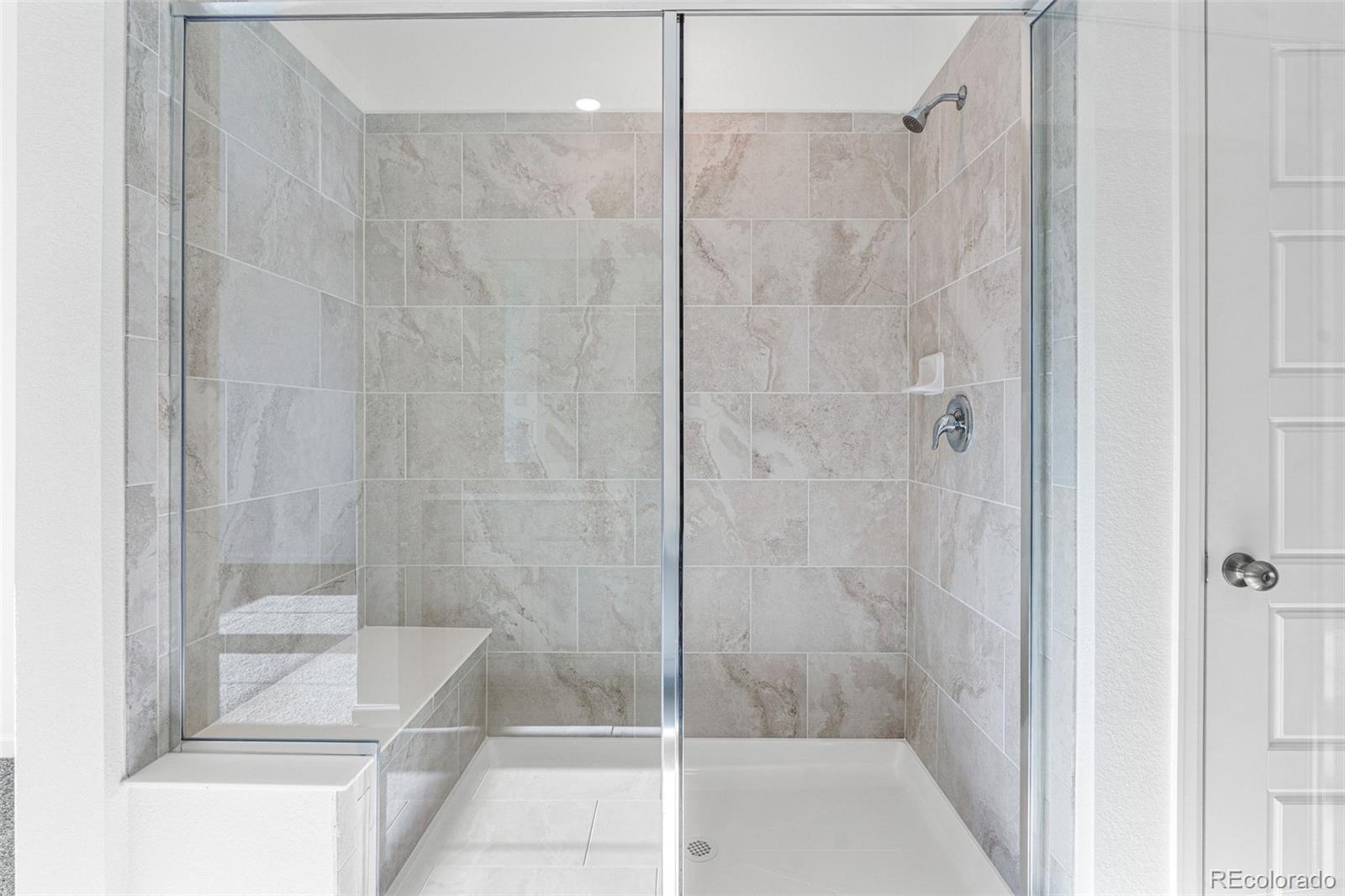 23936 River Front Drive Aurora, CO 80019 - Photo 27 of 46 a bathroom with a shower