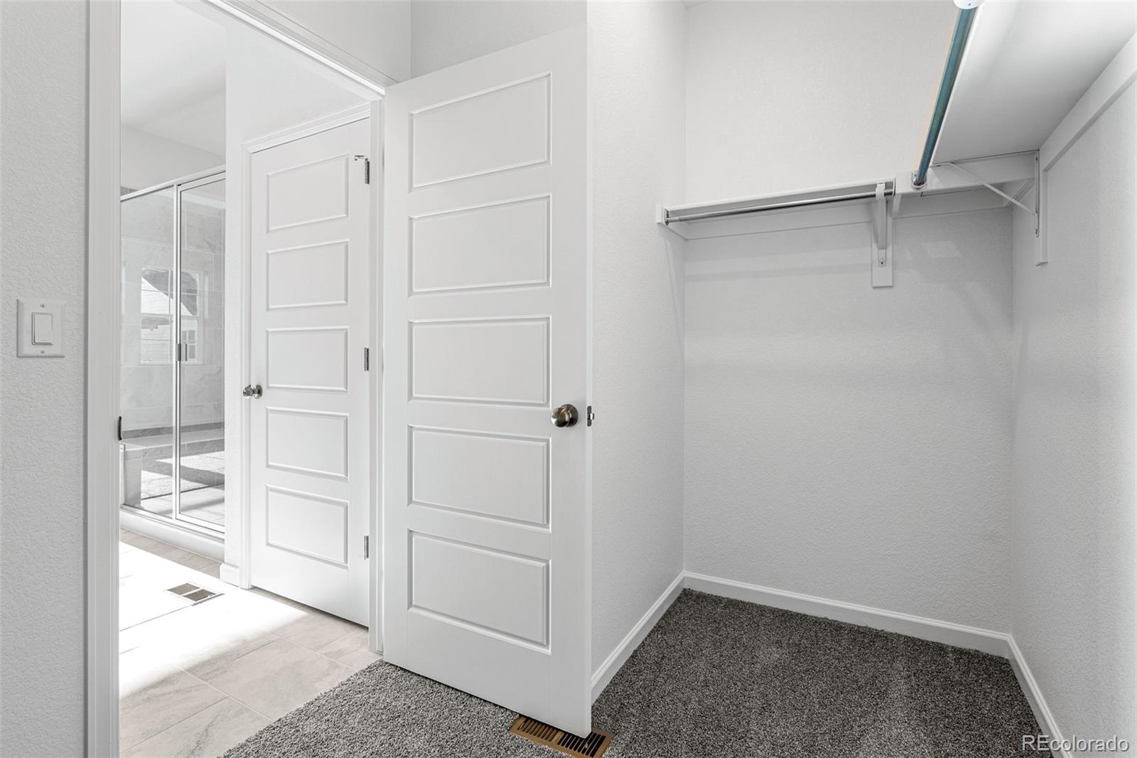 23936 River Front Drive Aurora, CO 80019 - Photo 28 of 46 a view of an empty walk in closet