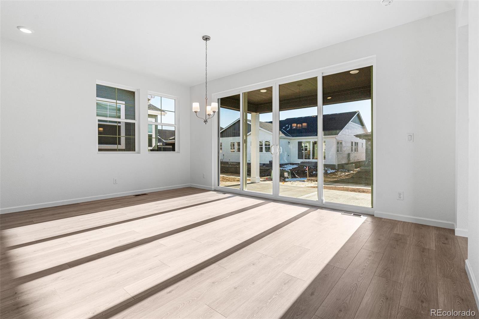 23936 River Front Drive Aurora, CO 80019 - Photo 7 of 46 a bedroom with a bed and a window