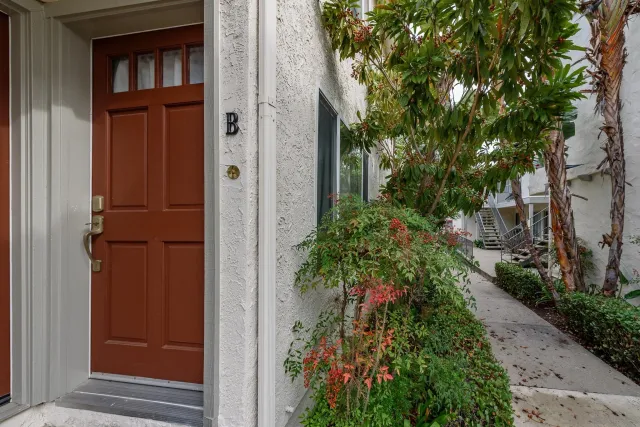 an empty room with wooden floor and closet