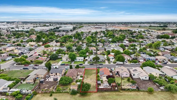 an aerial view of multiple house with yard