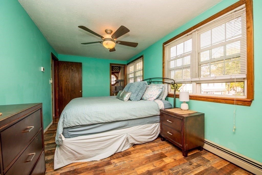 9 Grant Street Wareham, MA 02571 - Photo 11 of 18 a bedroom with a large bed and a large window