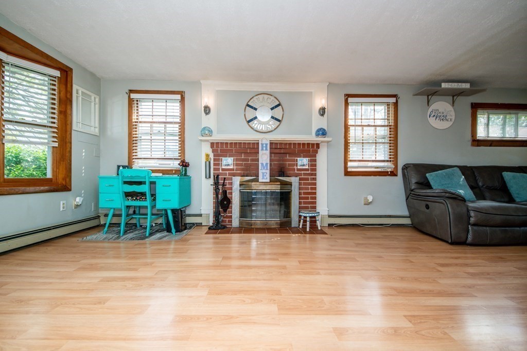 9 Grant Street Wareham, MA 02571 - Photo 7 of 18 a living room with furniture a table and a large window