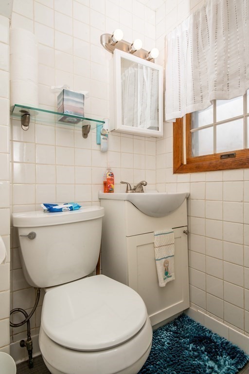 9 Grant Street Wareham, MA 02571 - Photo 10 of 18 a bathroom with a toilet and a sink